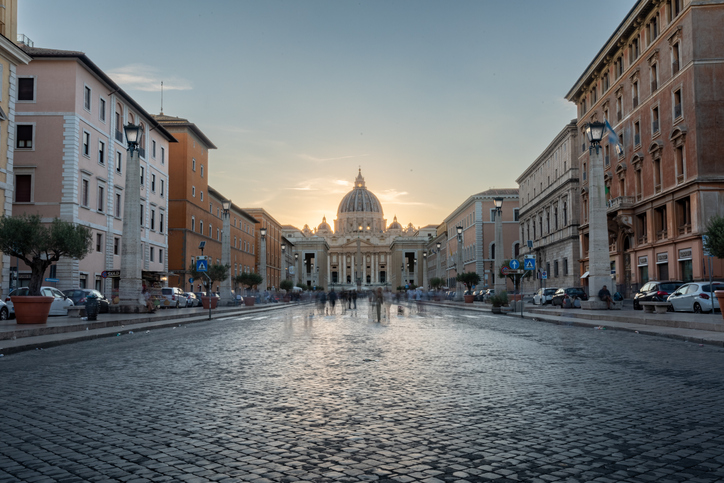 Long Exposition Shot of Via della Conciliazione in front of Piazza San pietro in the Centre of Rome at Sunset on Blurred Background